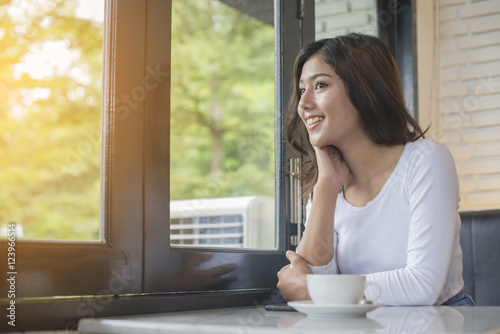 Beautiful young woman with morning coffee