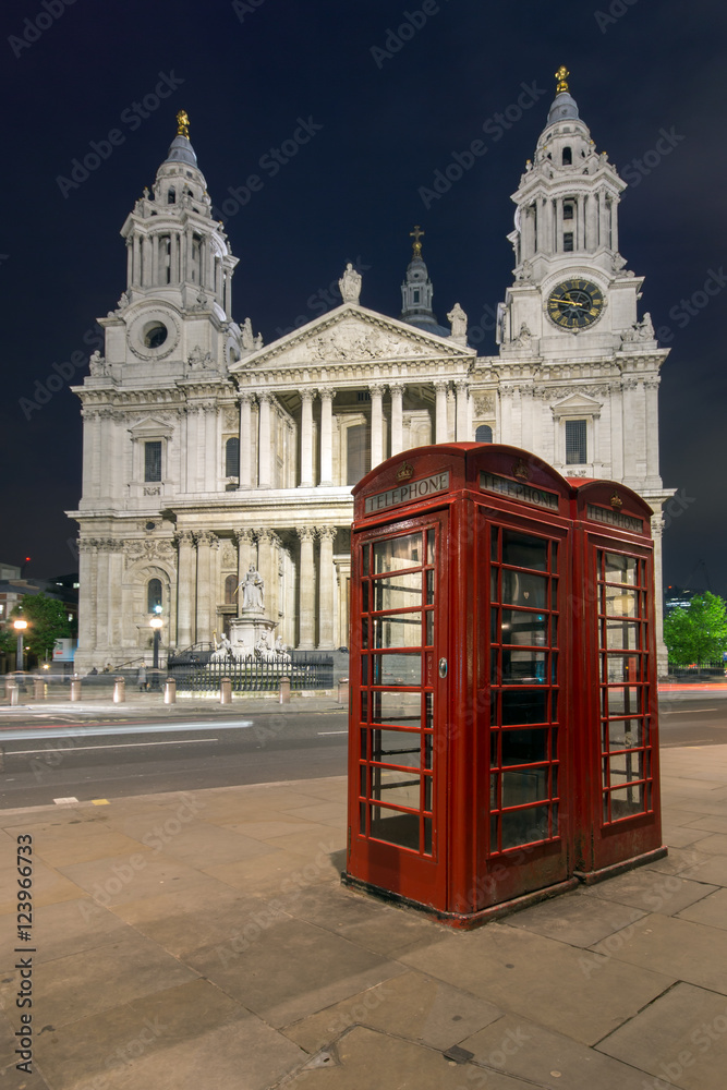 Night photo phone booth and St. Paul's Cathedral in London, Great Britain