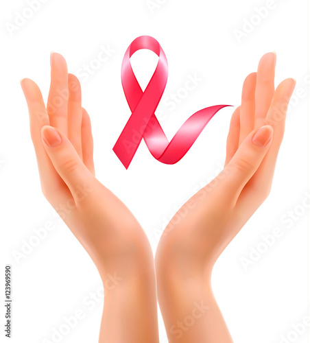 Breast cancer awareness. Hands holding a stethoscope with a pink