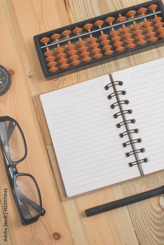 Spiral notebook on wood background Spiral notebook on wood background