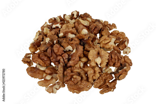 Pile of peeled walnuts isolated on white background