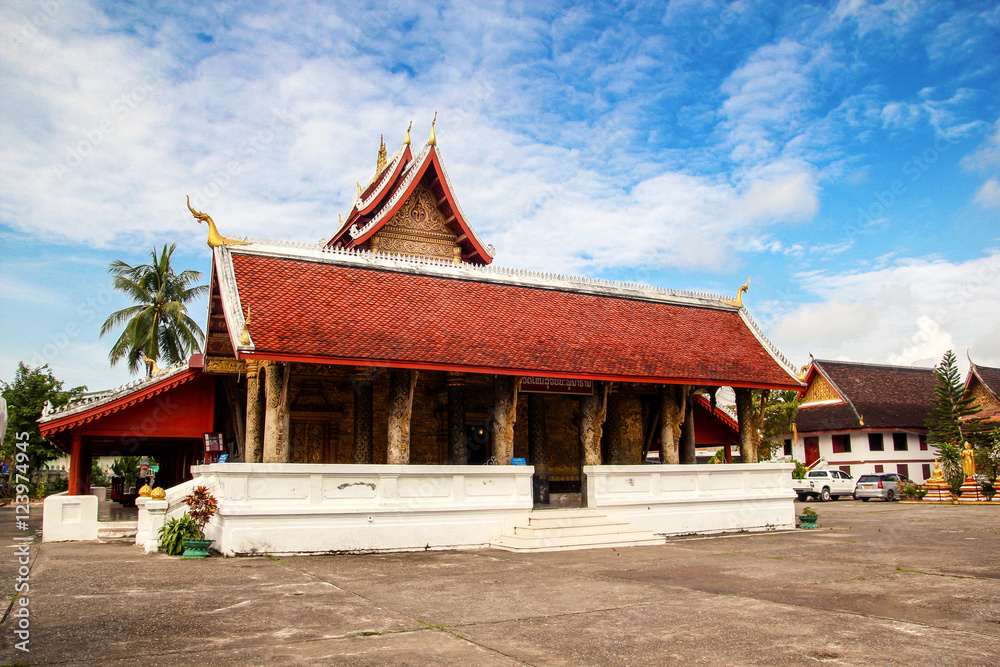 Naklejka premium Holy red roof temple in Luang Prabang, Laos