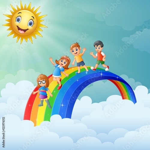 Children standing over the rainbow with smiling sun character