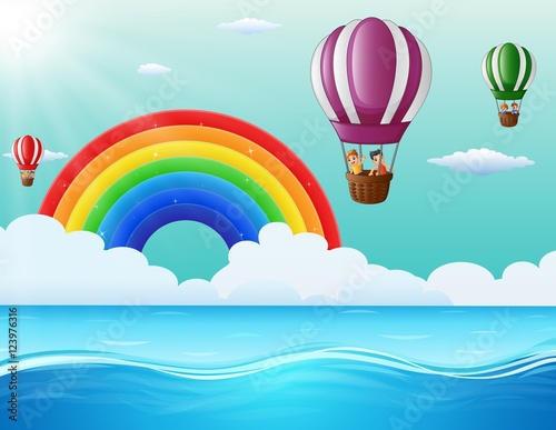 Happy cartoon kids flying in a hot air balloon in ocean