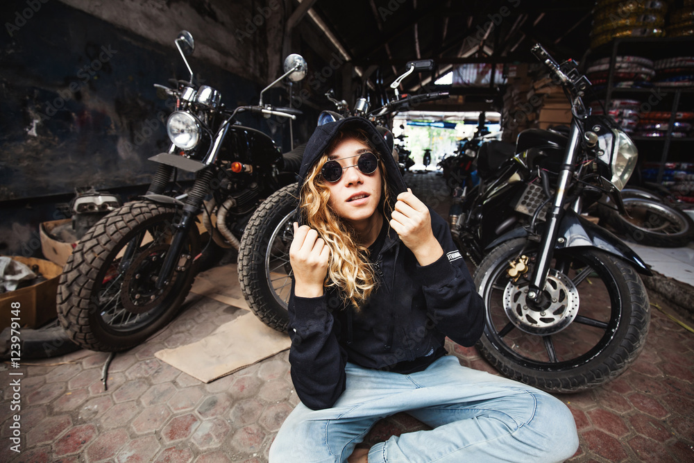 urban style girl in a grunge garage