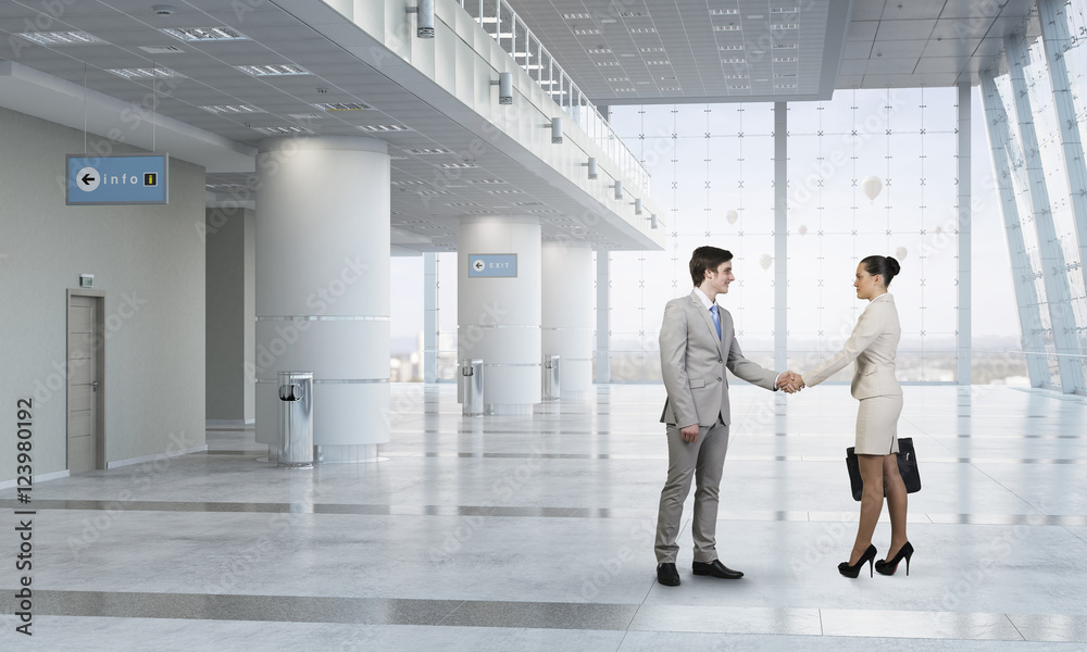 Business partners greeting each other . Mixed media Business partners greeting each other . Mixed media
