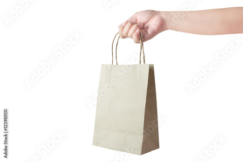 Hand holding paper bag isolate on white background