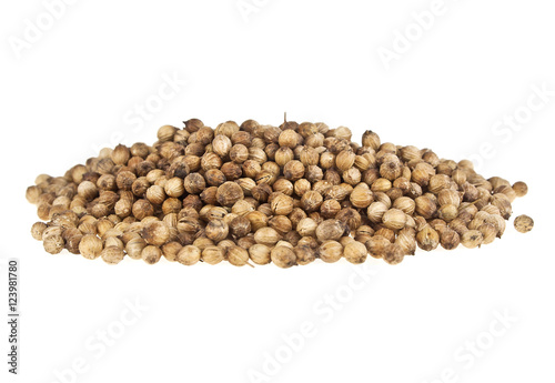 Heap of coriander seeds isolated on white background