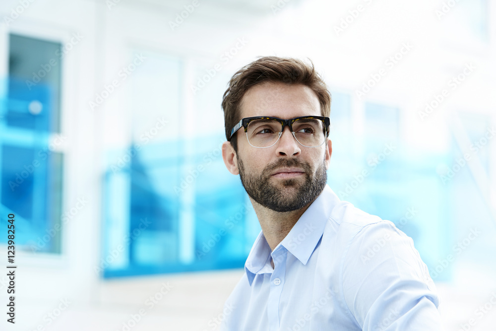 Serous man with stubble and glasses Serous man with stubble and glasses
