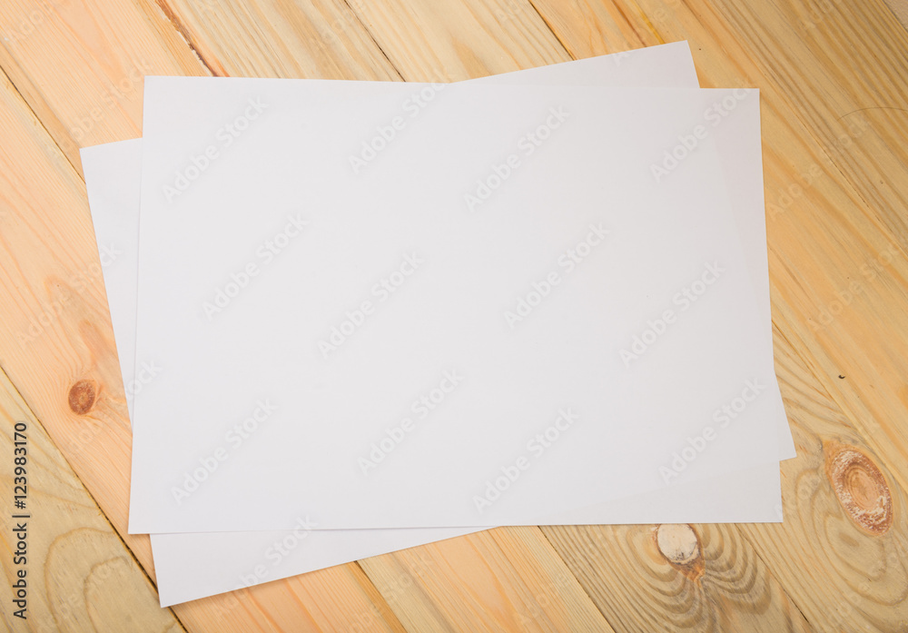 Blank paper on wood table