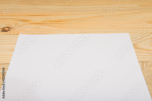 Blank paper on wood table