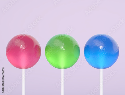 Three lollipops on a purple background © ptasha