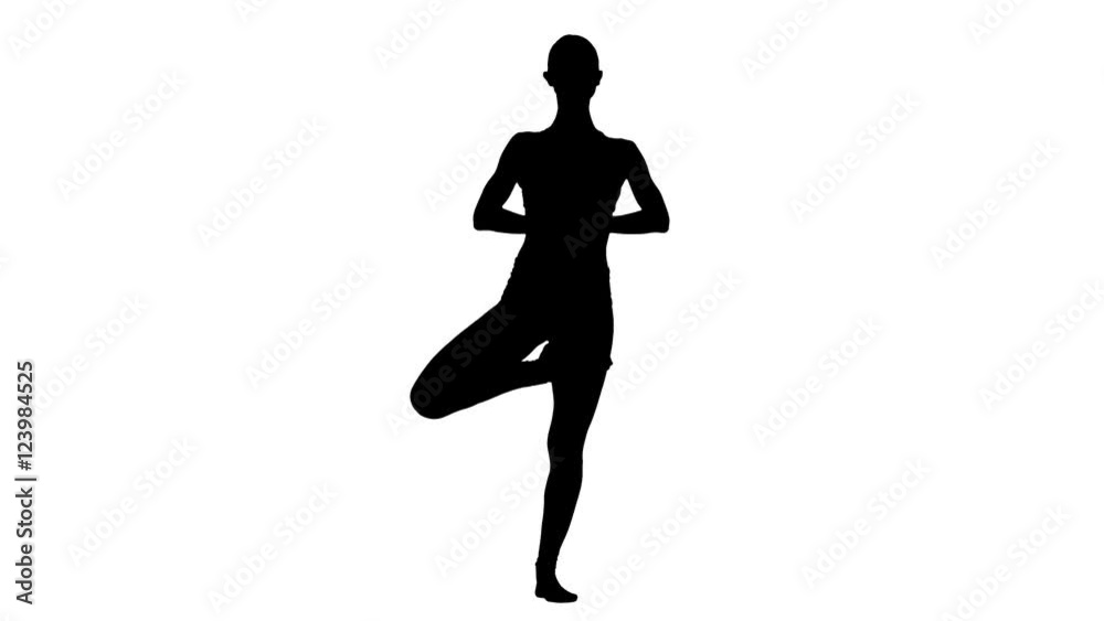 Girl makes yoga exercise on the white background. White background. Silhouette Girl makes yoga exercise on the white background. White background. Silhouette
