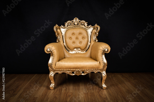 Antique armchair / throne with golden ornaments