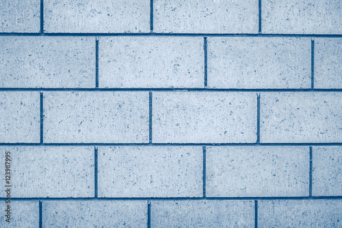 Blue concrete brick wall texture and background closeup view