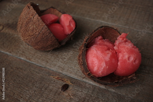 balls of watermelon in a coconut shell photo