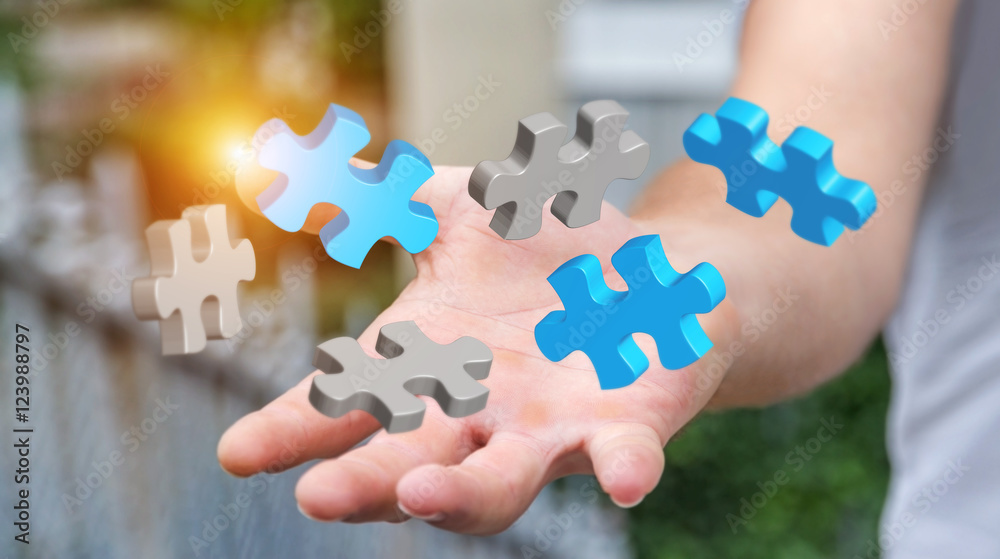 Businessman holding flying puzzle pieces ‘3D rendering’ Businessman holding flying puzzle pieces ‘3D rendering’