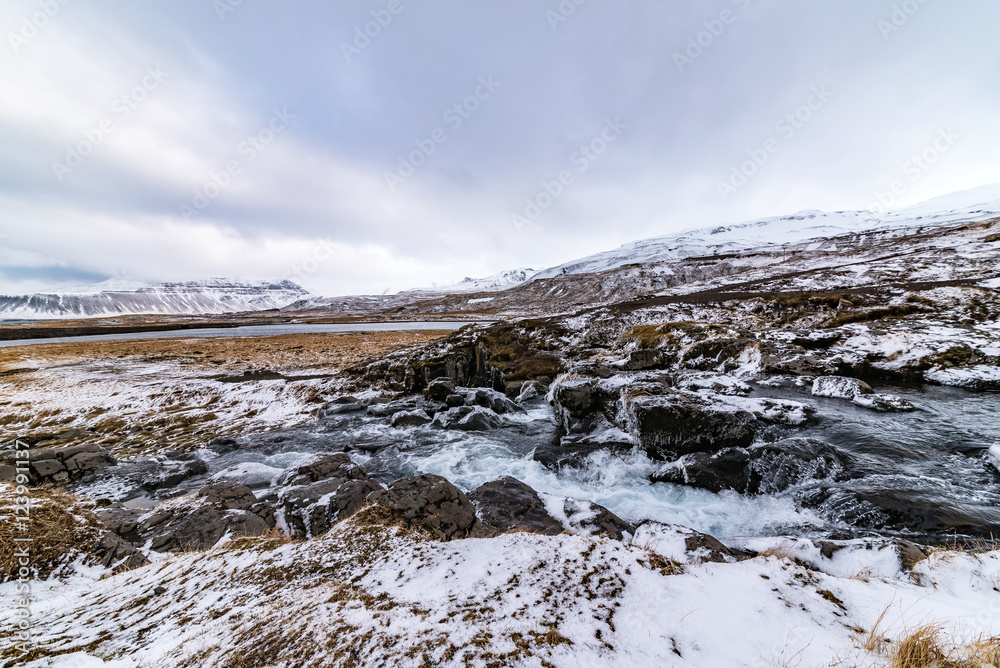 waterfall kirkjufellsfoss at wintertime, iceland
