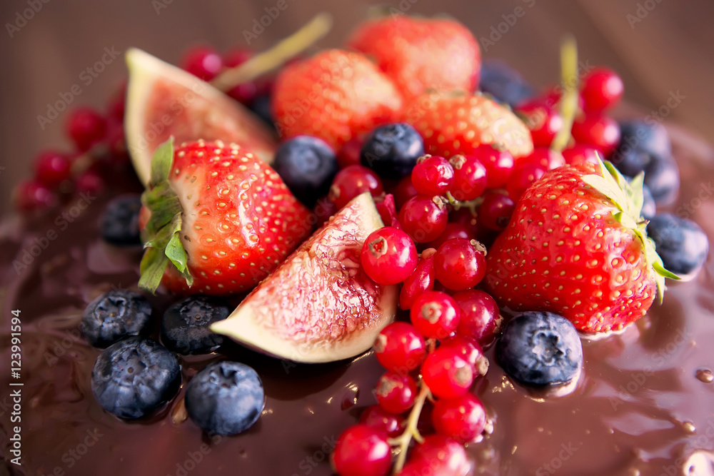Birthday cake with cream and chocolate, fresh fruit and berries slide. Birthday cake with cream and chocolate, fresh fruit and berries slide.