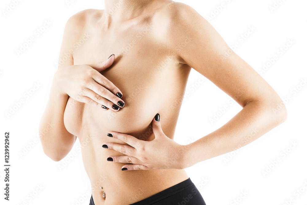 Obraz premium Beautiful slim woman covering her nude breast isolated on white