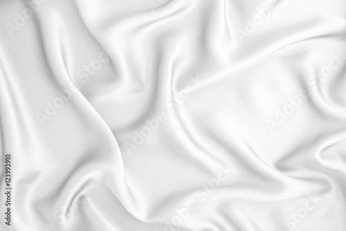 Close up wave luxury white silk or satin fabric background