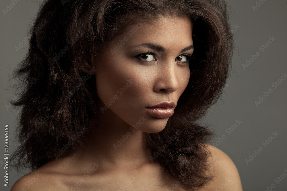 Portrait of an extraordinary beautiful naked metis young woman with perfect smooth glowing skin, full lips and lush loose brown hair. Studio shoot of an african american female model Portrait of an extraordinary beautiful naked metis young woman with perfect smooth glowing skin, full lips and lush loose brown hair. Studio shoot of an african american female model
