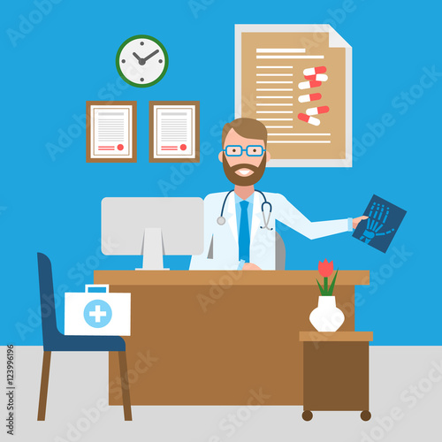 Doctor in the cabinet. Funny smiling male doctor in the medical cabinet. Medical treatment, first aid.