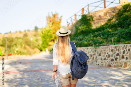 Hipster Traveler with backpack and outspread hands. 