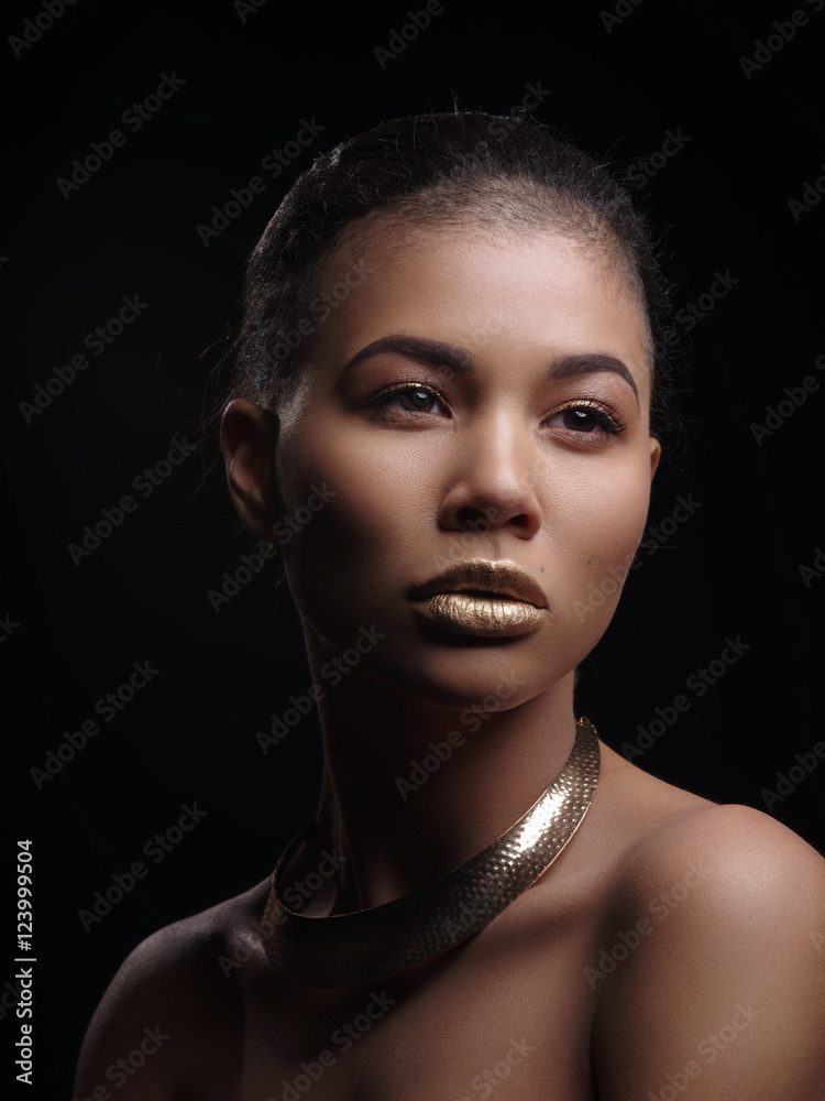 Portrait of an extraordinary beautiful naked african american model with perfect smooth glowing