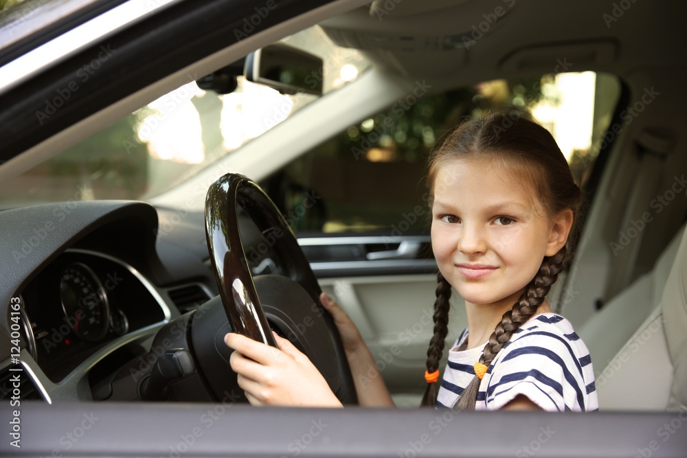 Girl driving parent car