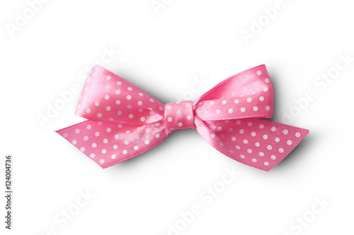 Beautiful pink bow with polka dot pattern on white background