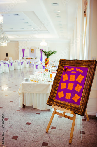 An easel with violet board stands in the entrance to the restaur