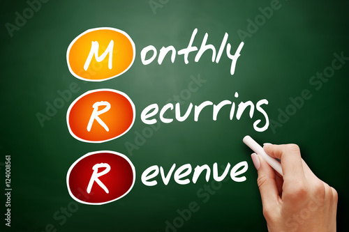 Hand drawn MRR - Monthly Recurring Revenue, acronym business concept on blackboard