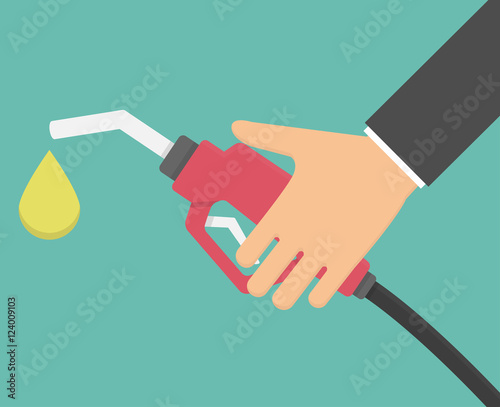 Hand holding gas pump