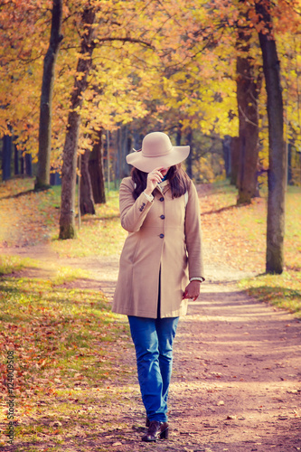 Woman in autumn park. © lizavetta