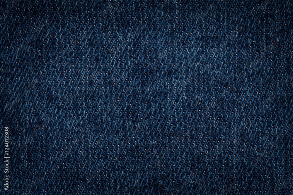 Dark blue denim background closeup. Textured fabric Dark blue denim background closeup. Textured fabric