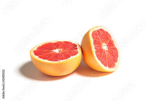Sliced or cut grapefruit isolated on white