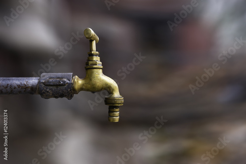bronze tap isolated on the blurred background