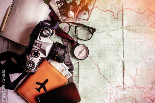 wanderlust and adventure concept, compass camera phone passport photo