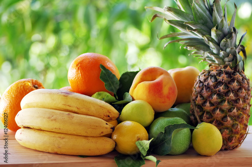 fruits on table, green background