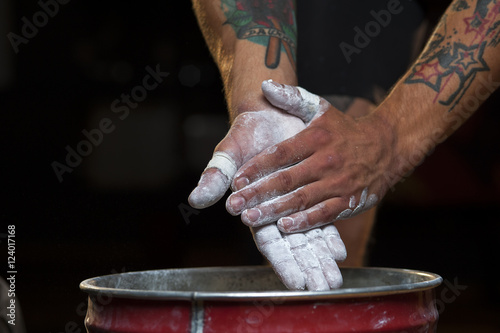 Closeup of male hands with chalk powder