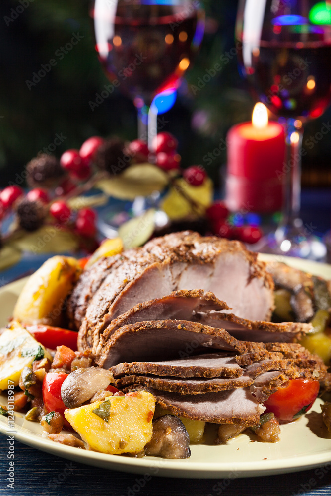 Juicy roast pork on the holiday table Juicy roast pork on the holiday table