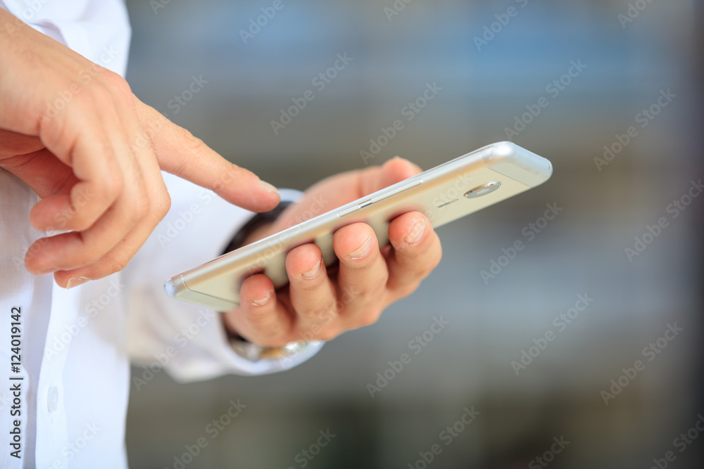 Businessman holding a smartphone