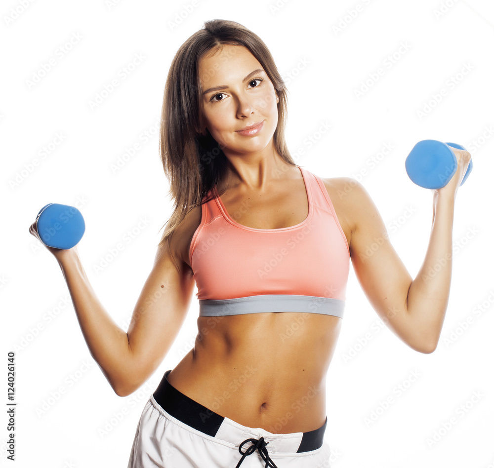 young pretty slim woman with dumbbell isolated young pretty slim woman with dumbbell isolated
