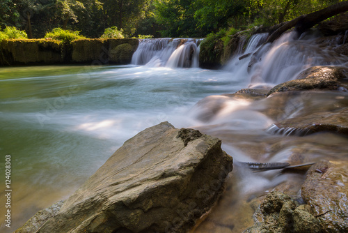 Stone with bay of waterfall