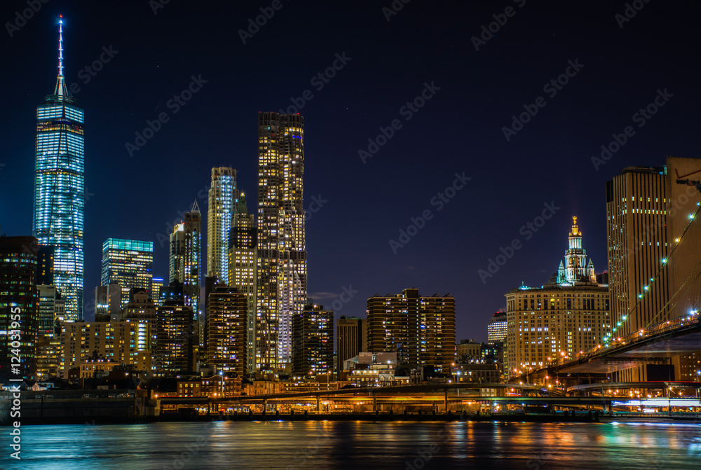 Night view of the skyscrapers of New York City from the Brooklyn Bridge Park.
