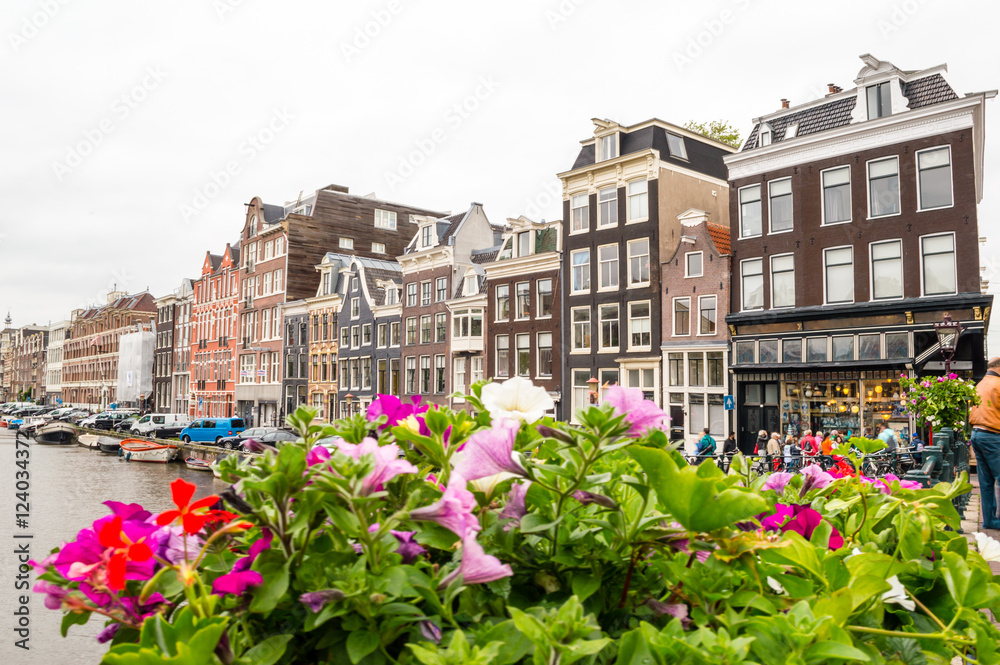 Canal, flowers and typical Amsterdam buildings, Netherlands