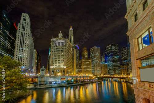 Chicago River skyline with urban skyscrapers at night  IL  USA