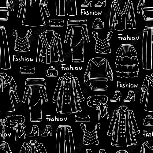 Pattern with hand drawn isolated fashionable clothes for women on black background