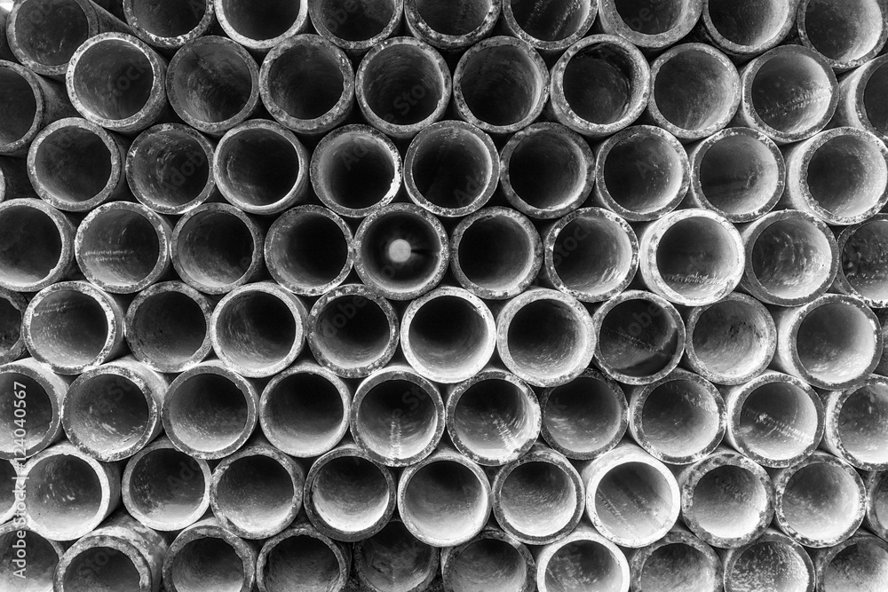 Abstract Steel pipes arranged on shelves on black and white tone Abstract Steel pipes arranged on shelves on black and white tone